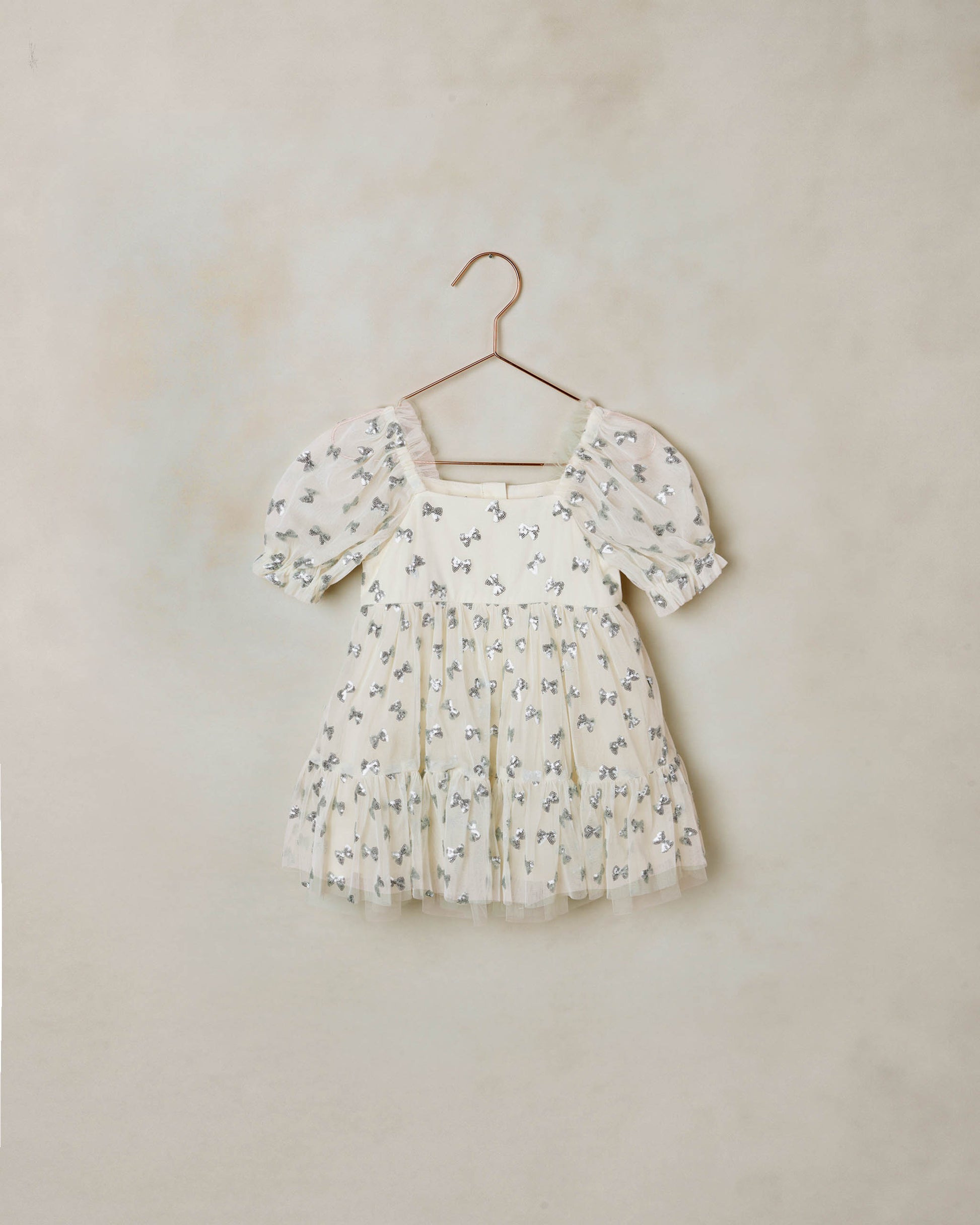 Noralee Louella Dress with sequin bows in natural color, featuring a stylish design and decorative sequins on the front.
