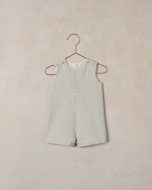 Boy's Georgie Romper in Sky Stripe by Noralee, featuring a cute sleeveless design with blue and white stripe pattern.