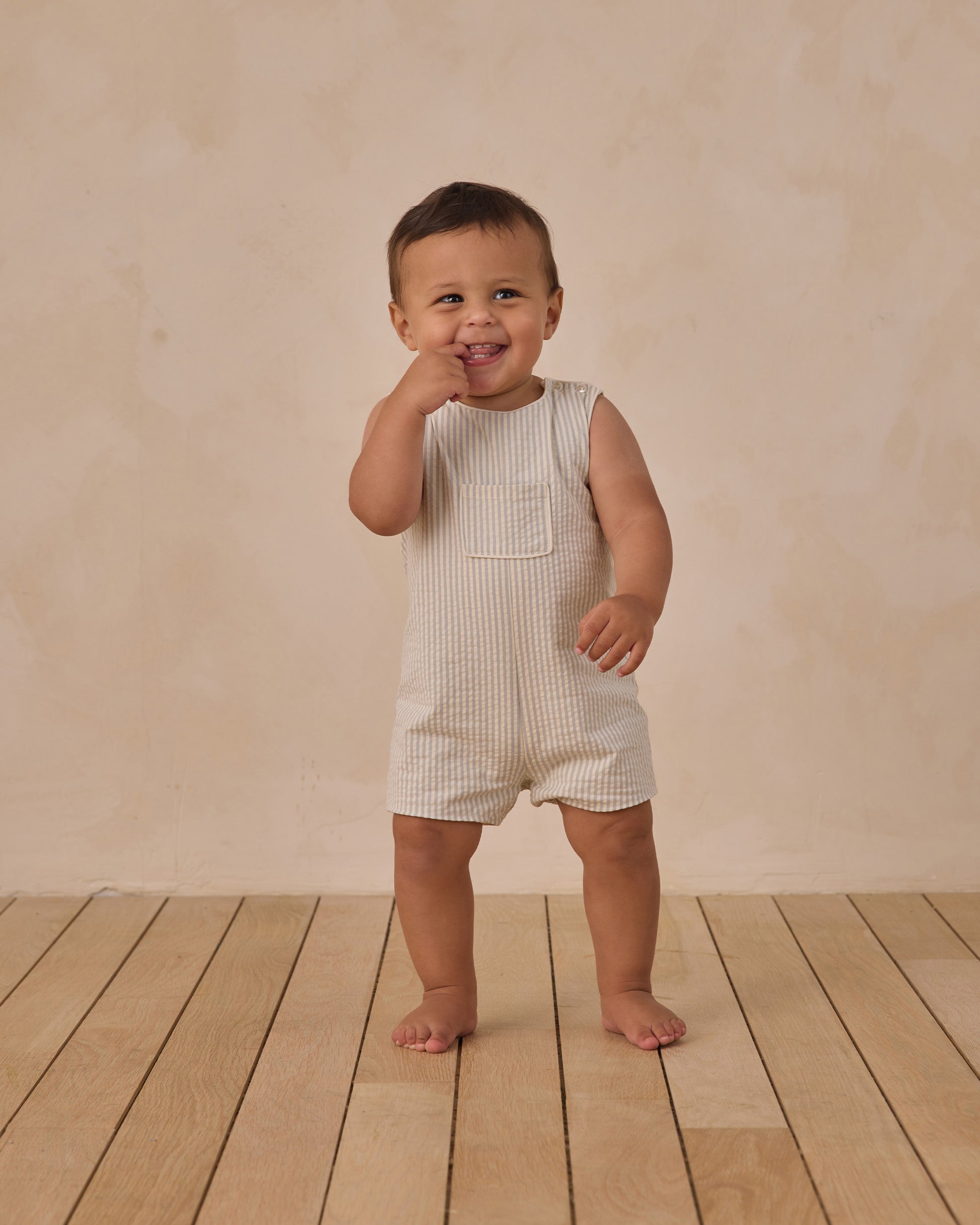 Boy's Georgie romper by Noralee featuring blue and white sky stripe pattern, soft fabric, and comfortable fit.