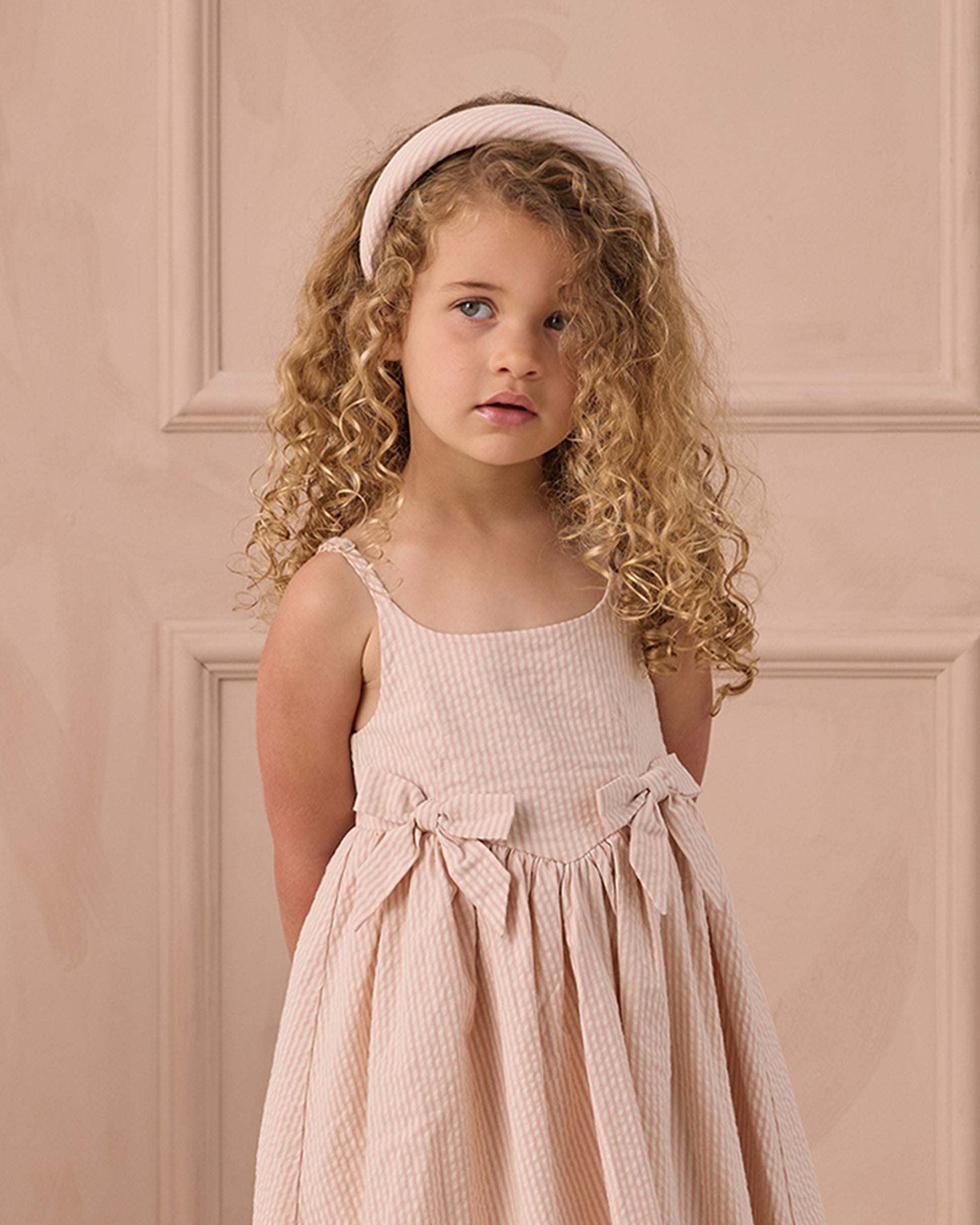 Girls Beatrice Midi Dress in Petal Pink by Noralee, showing the elegant dress with soft pink fabric and delicate design details.