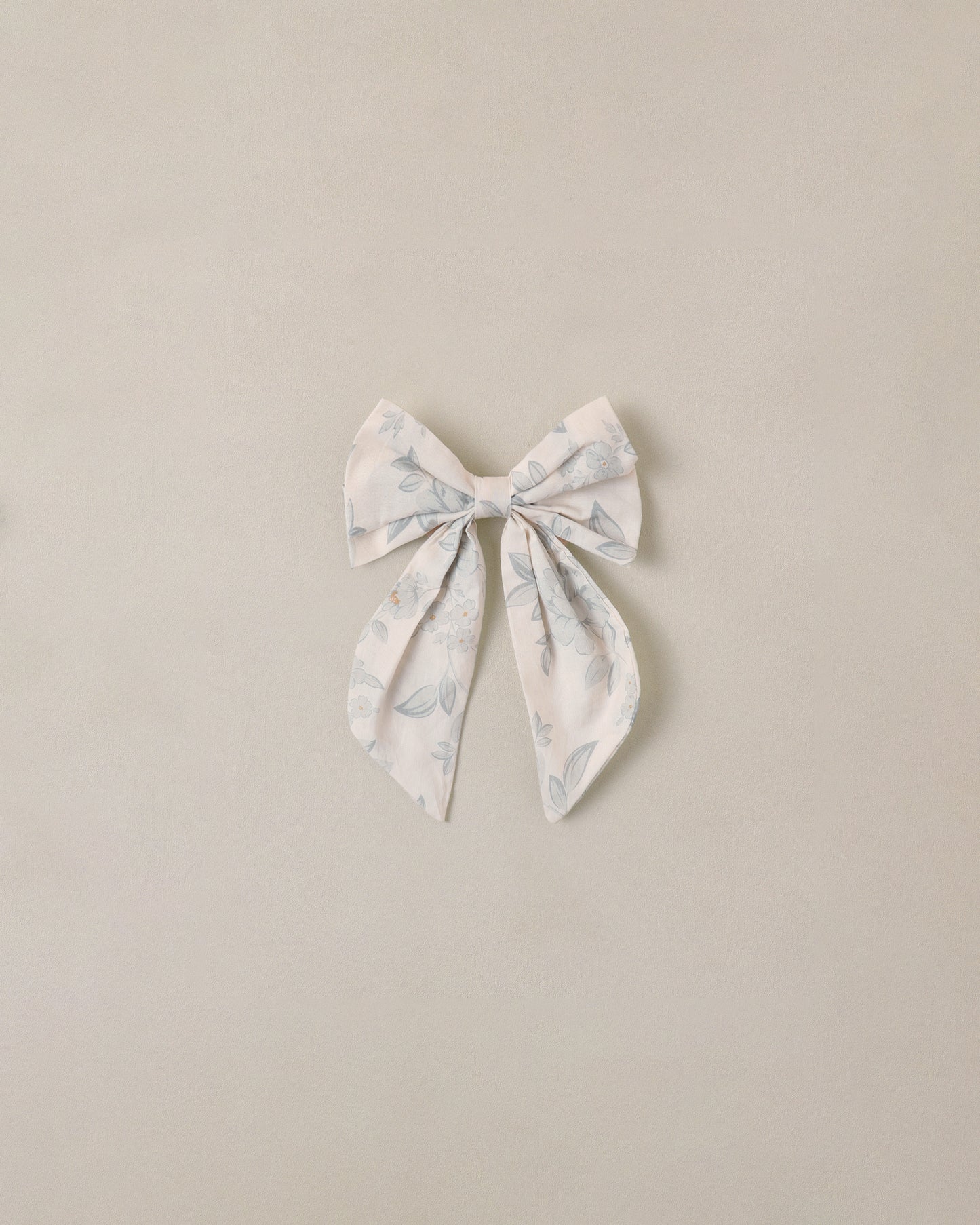 Everly Bow Mist in English Rose by Noralee, featuring a soft ivory bow and elegant floral design.