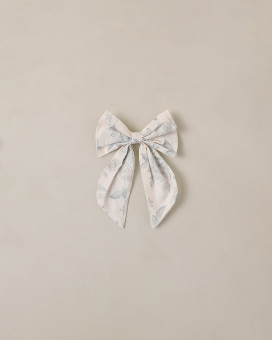 Everly Bow Mist in English Rose by Noralee, featuring a soft ivory bow and elegant floral design.
