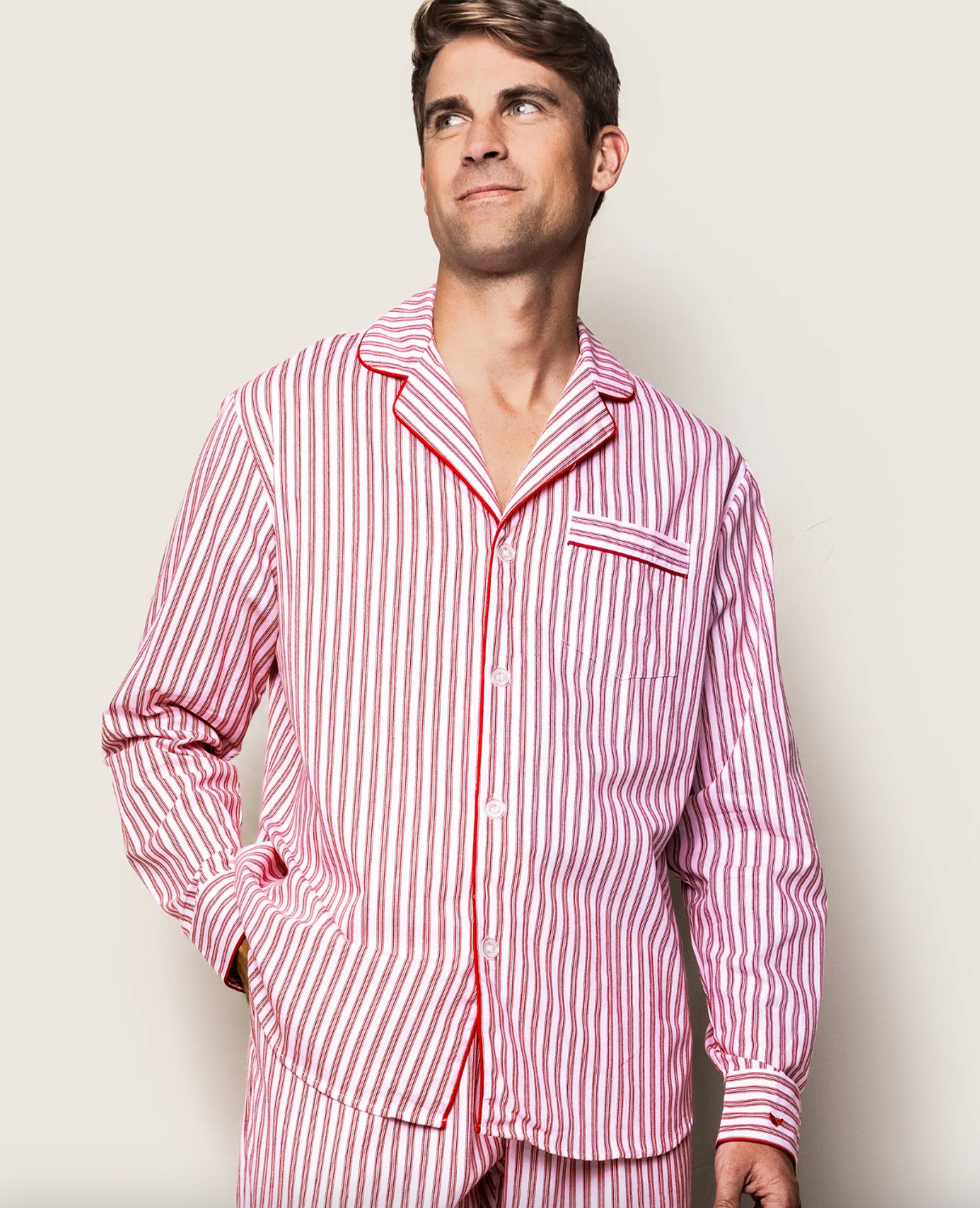 Men's antique red ticking pajama set by Petite Plume, featuring a button-up top and matching pants with classic ticking pattern.