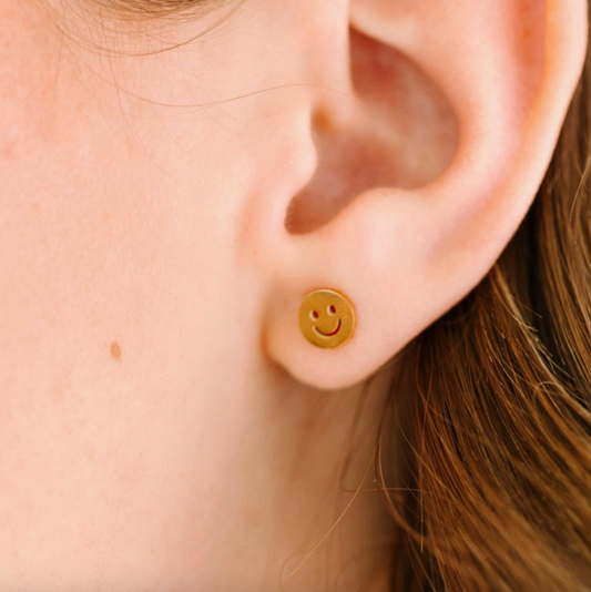Pierced Co classic smiley face screw back earring with a cheerful yellow smiley design on a silver-tone metal backing