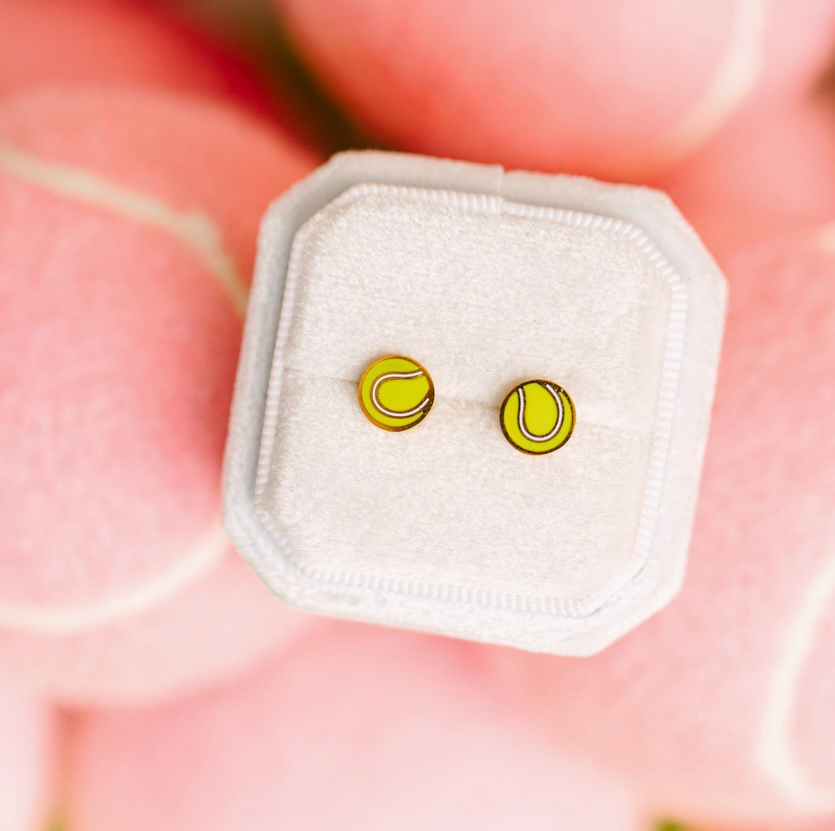 Girls tennis ball flat screw back earrings by Pierced Co featuring small, round tennis ball charm on silver-tone earrings.