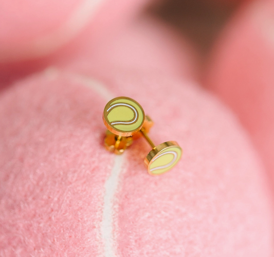 Girls tennis ball flat screw back earrings from Pierced Co featuring small, round tennis ball designs with secure screw back closures.