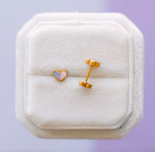 Pierced Co micro heart screw back earrings featuring delicate silver hearts on a secure screw back design.