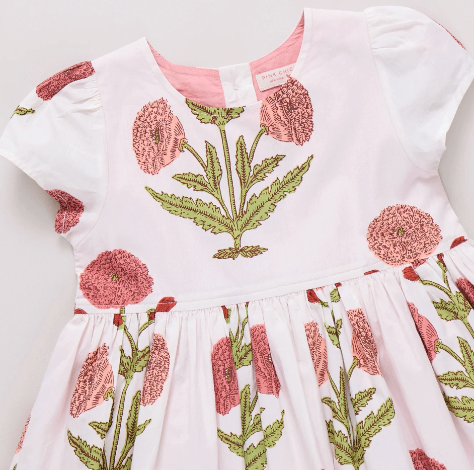 Girls Marisol Dress by Pink Chicken in Rose Dandelion fabric, featuring a charming pink dress with floral details.