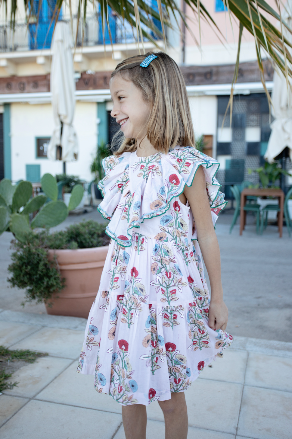 Girls Raphaela dress by Pink Chicken featuring a multi-bouquet floral pattern, sleeveless with a soft, lightweight fabric.