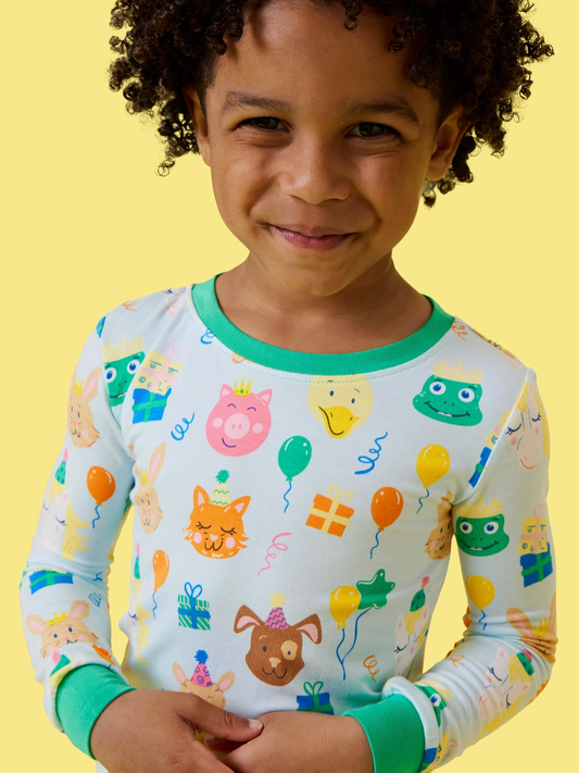 Kids bamboo viscose birthday party animals long sleeve pajama set by Ruffle Butts, featuring colorful animal prints on soft fabric.