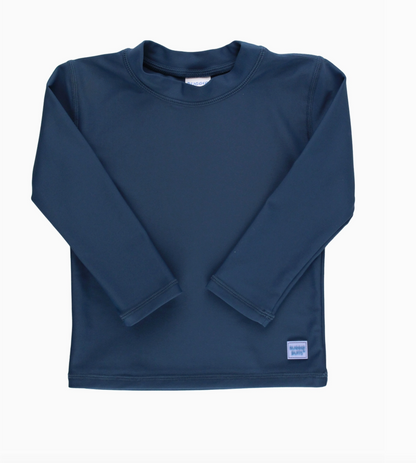 Kids navy long sleeve rash guard by Ruffle Butts, featuring a comfortable fit and sun protection for young children.
