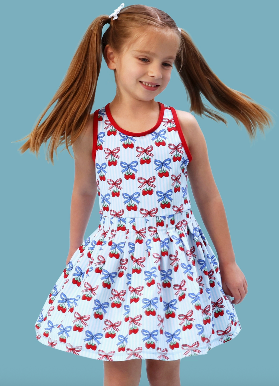 Girls Berries & Bows pleated skirt and active dress set with matching bike shorts, featuring a playful berry and bow pattern by Ruffle Butts.