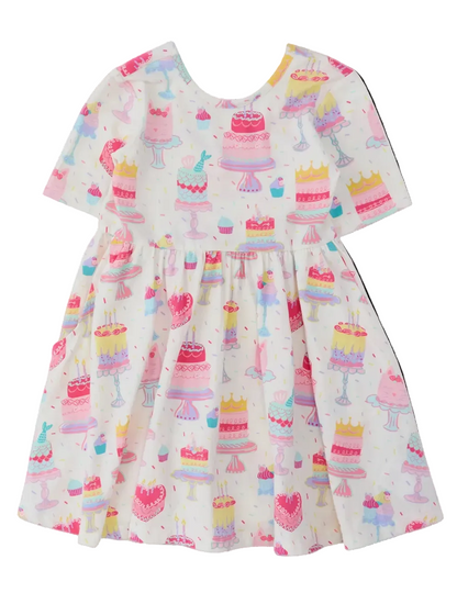 Girls birthday cake party knit twirl dress by Ruffle Butts, featuring short sleeves and a playful, colorful cake design.