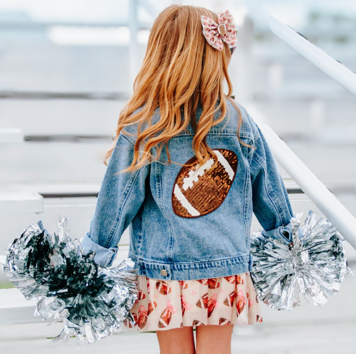 Girls' denim jacket with football-themed sequin patches, stylish Game Day design by Sweet Wink.
