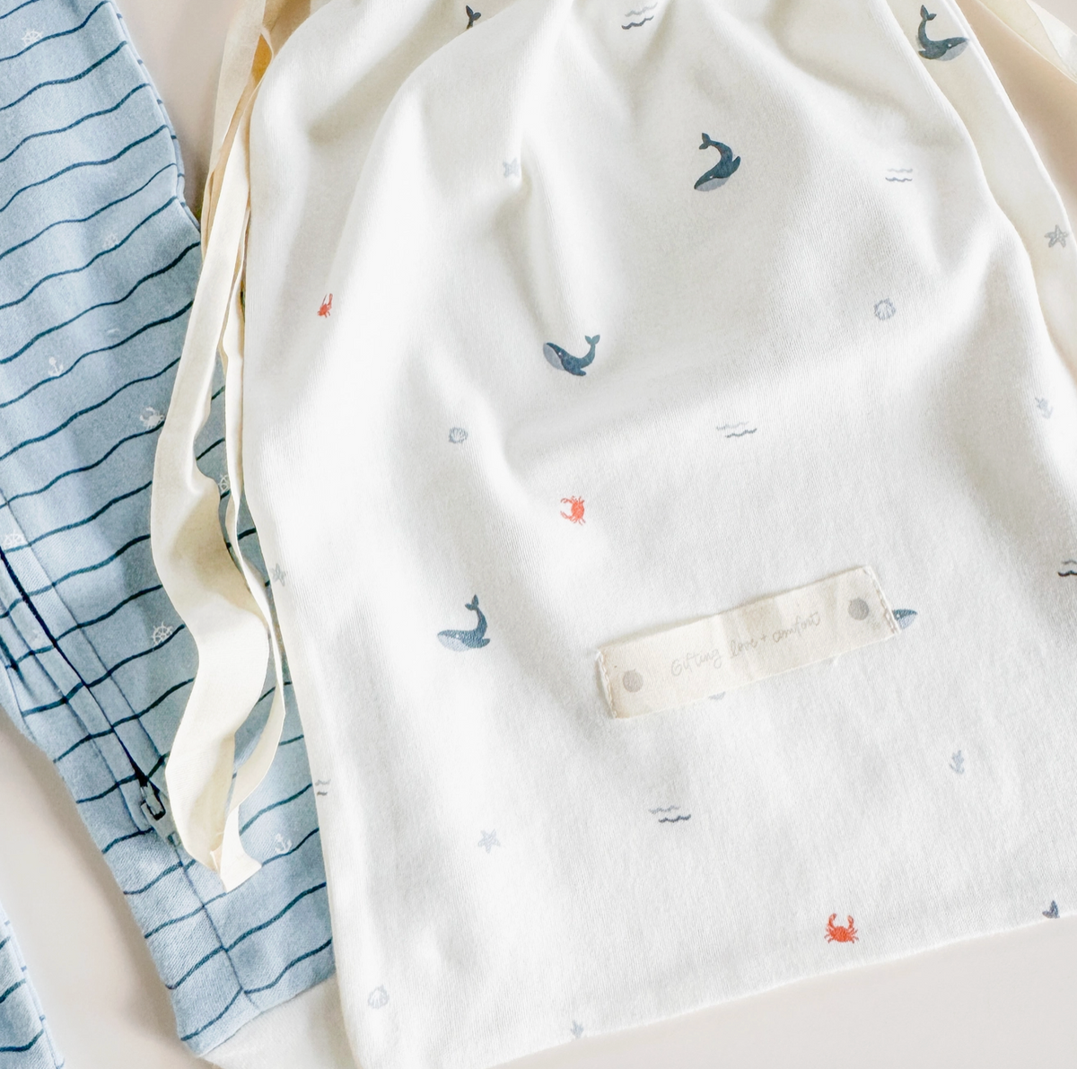 Organic cotton baby layette set with nautical ocean design from The Blueberry Hill, perfect for baby shower gift.