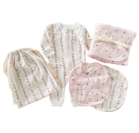 Pink strawberry-themed layette set by The Blueberry Hill for newborns, perfect for baby shower gifts.