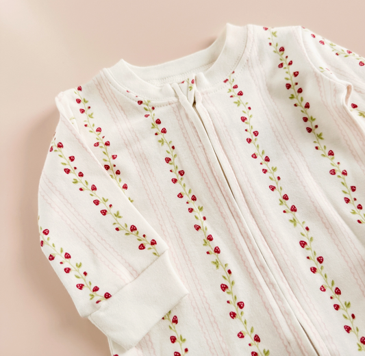 Pink strawberry and rose-themed layette set for newborns from The Blueberry Hill, perfect for baby shower gifts.