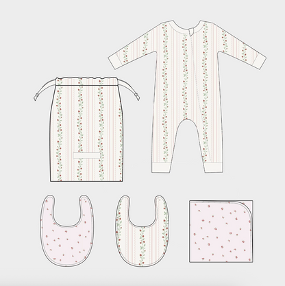 Pink strawberry and rose-themed newborn layette set by The Blueberry Hill, featuring soft baby clothes for a baby shower gift.