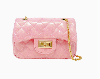Tiny Treat and Zomi Gems classic quilted sparkle mini purse in vibrant bubblegum pink with a shiny, textured exterior.
