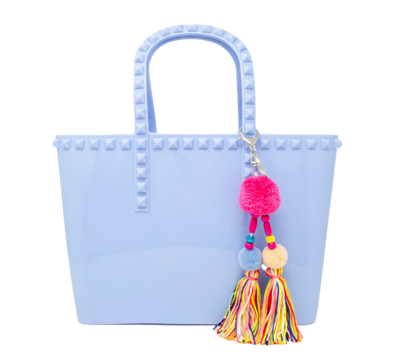 Kids jumbo jelly tote bag with tassel in baby blue by Tiny Treat and Zomi Gems, showing the colorful, transparent tote with tassel detail.