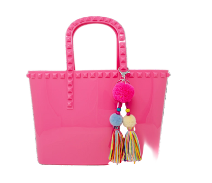 Kids jumbo jelly tote bag with tassel in hot pink from Tiny Treat and Zomi Gems, featuring a clear, flexible design for children.