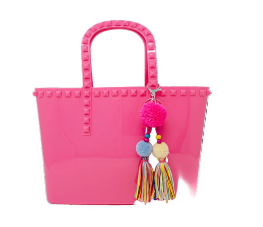 Kids jumbo jelly tote bag with tassel in hot pink from Tiny Treat and Zomi Gems, featuring a clear, flexible design for children.