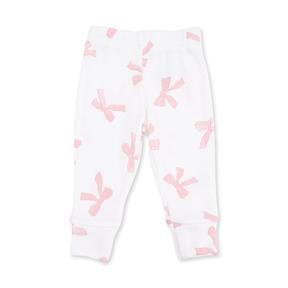 Baby girl wearing a pink long sleeve ruffle top and matching pants set by Angel Dear, with soft fabric and cute ruffle details.