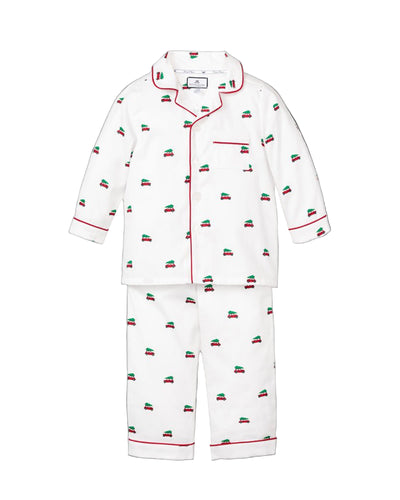 White pajama set with red and green pattern on a white background