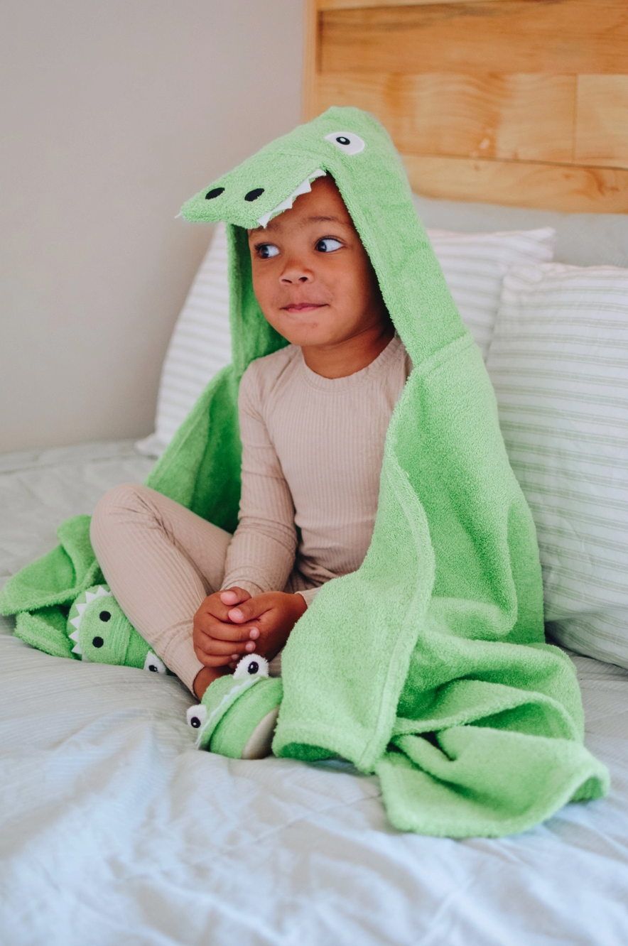 Kids Yikes Twins alligator hooded towel featuring a green alligator design and a cozy hood, perfect for bath time.