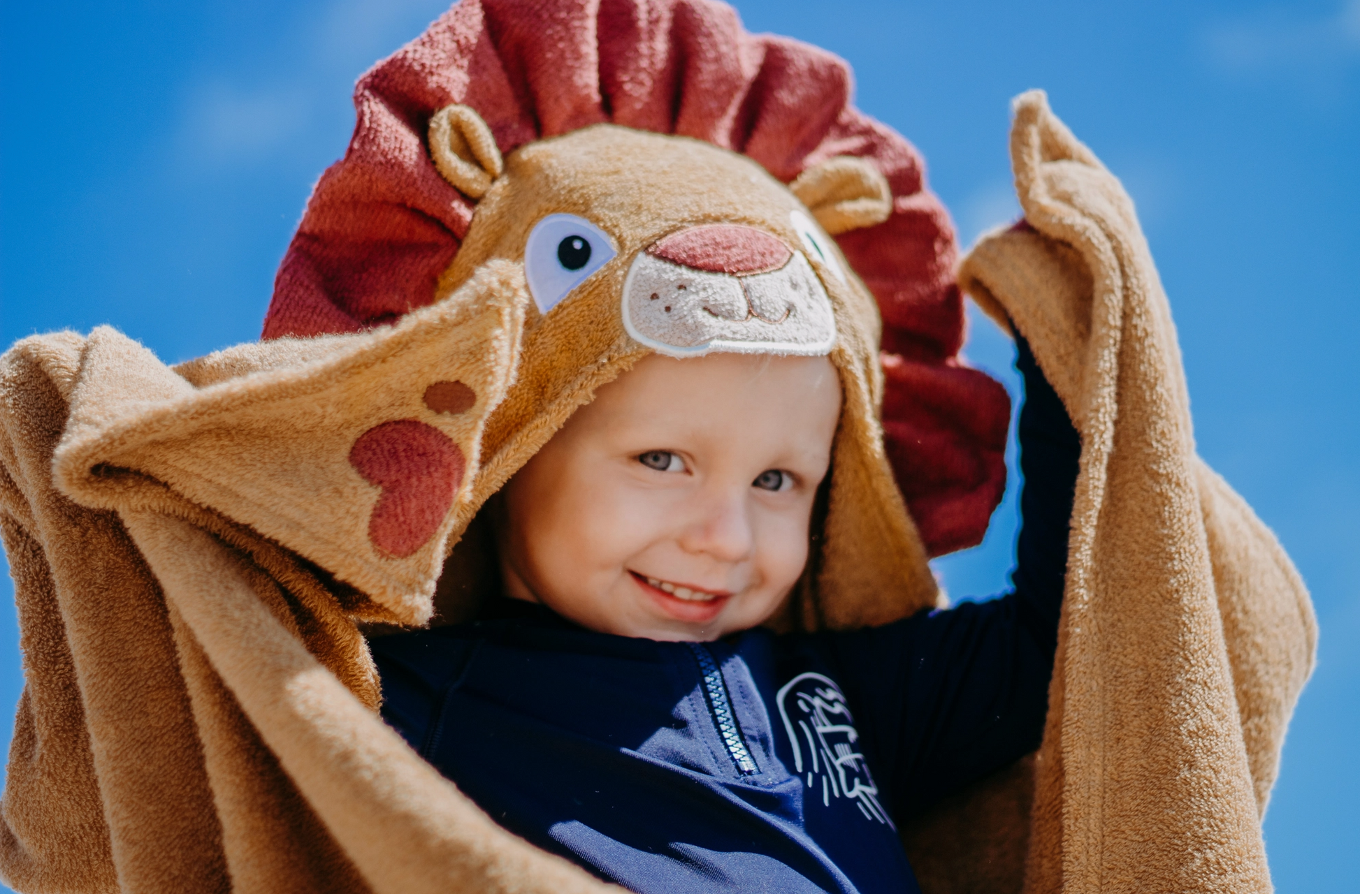 Kids lion hooded towel by Yikes Twins featuring a soft, plush fabric with a lion face hood for fun bath time.