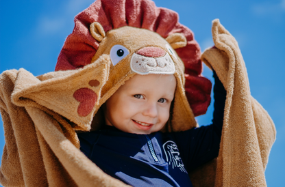 Kids lion hooded towel by Yikes Twins featuring a soft, plush fabric with a lion face hood for fun bath time.