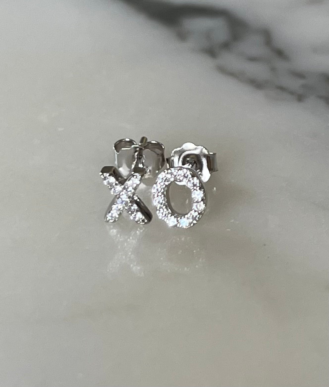 Jack and Jewelz XO earrings with sparkling pave stones, featuring a stylish and elegant design.