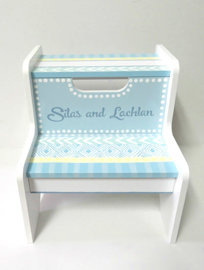 Hand painted 2-step stool by Flora Ottimer, featuring vibrant floral designs on a wooden step stool.