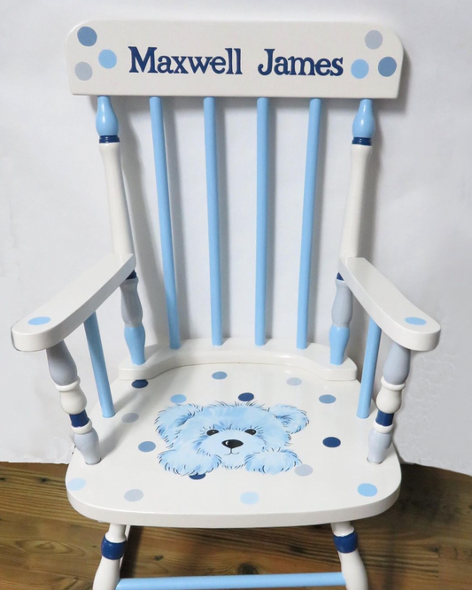 Hand-painted wooden rocking chair by Flora Ottimer, showcasing intricate artwork on a classic furniture piece.