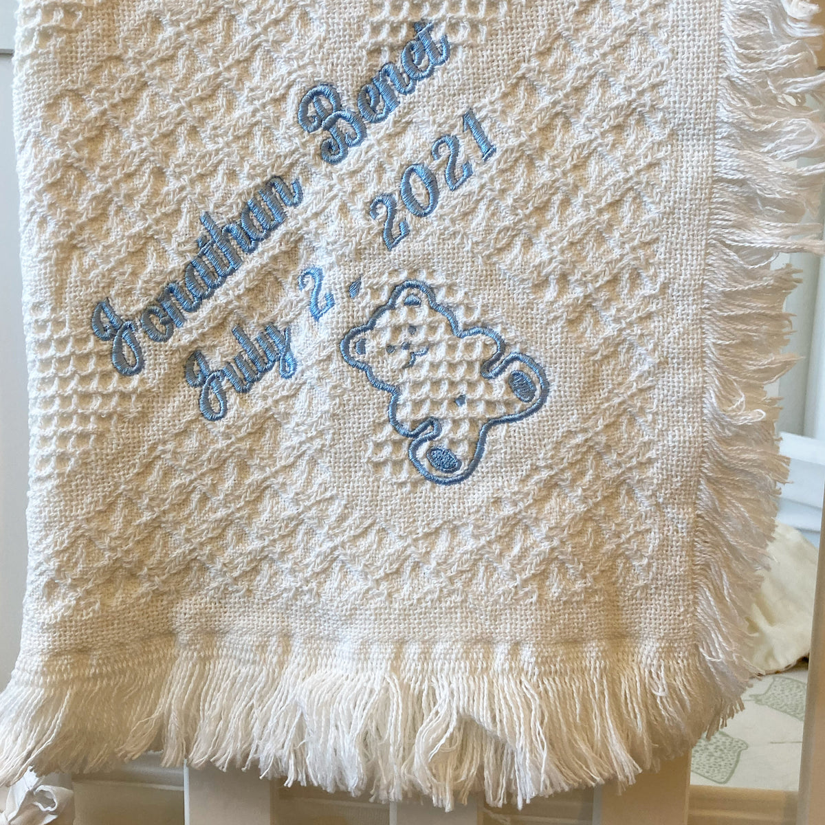 Monogrammed Flora Ottimer cotton carriage throw with elegant design and soft texture, perfect for cozy home decor.