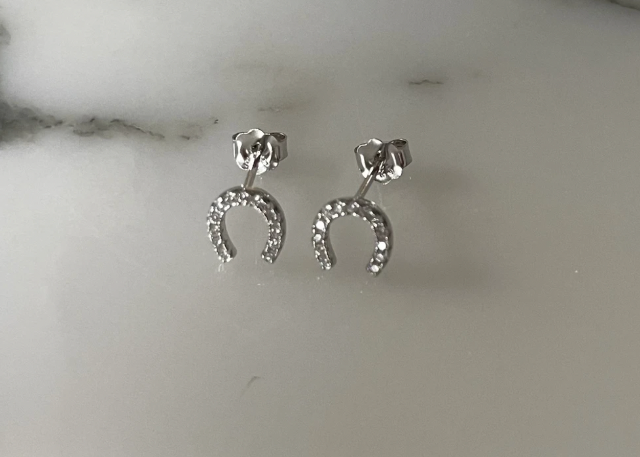 Jack and Jewelz Lucky Horse Shoe CZ earrings featuring sparkling cubic zirconia stones and a horse shoe design.