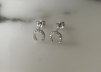 Jack and Jewelz Lucky Horse Shoe CZ earrings featuring sparkling cubic zirconia stones and a horse shoe design.