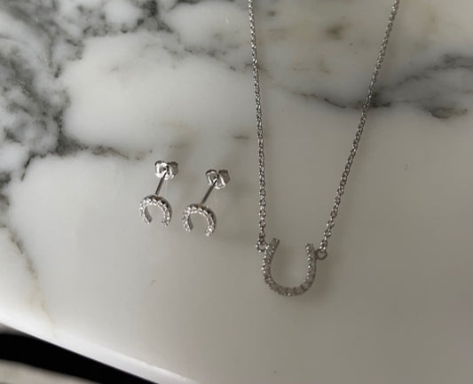Lucky horse shoe CZ earrings by Jack and Jewelz featuring sparkling cubic zirconia accents on gold-tone horse shoe design.