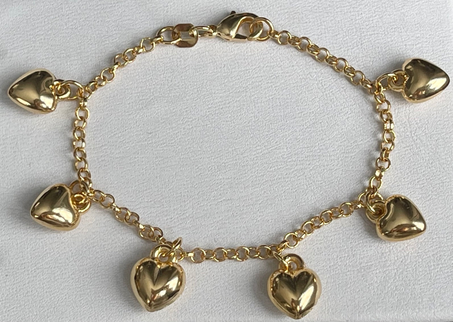 Jack and Jewelz puffed heart charm bracelet featuring a delicate chain and a prominent puffed heart pendant.
