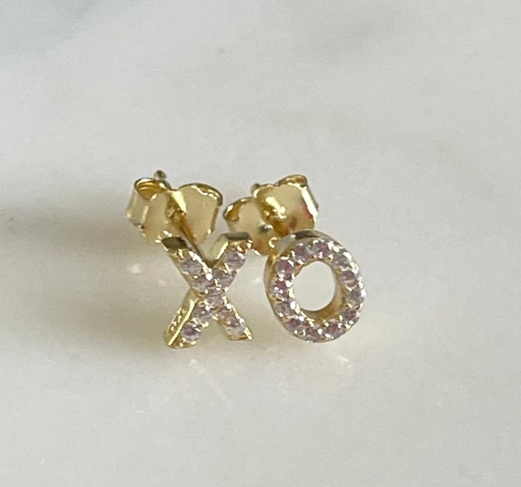 Jack and Jewelz XO earrings with pave stones, showcasing sparkling gold-tone earrings with intricate pave detailing.
