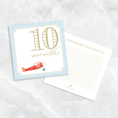 Blue baby milestone card set by Katherine Kelly showing numbered milestone cards for boys with playful designs.