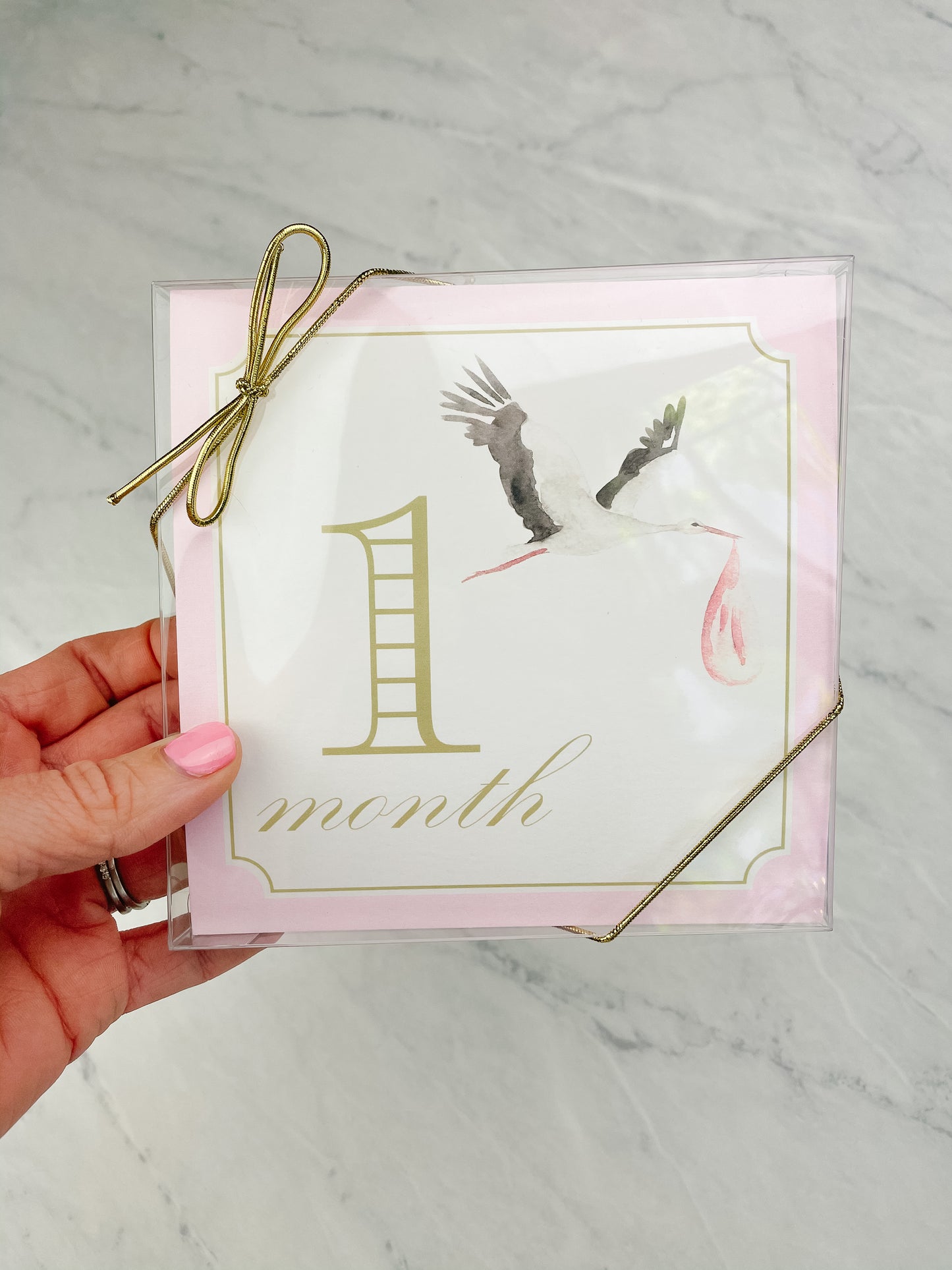 Pink Katherine Kelly baby milestone card set with decorative packaging, includes cards for marking baby's special moments.