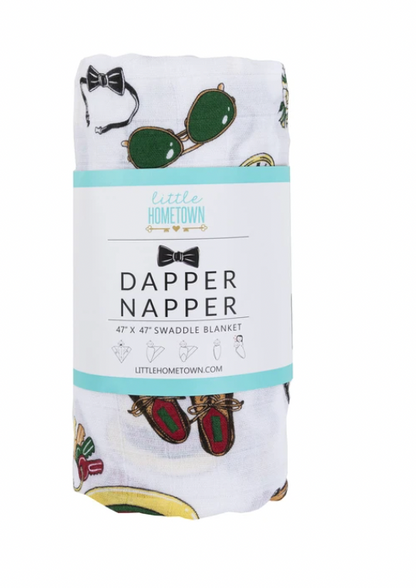 Baby wrapped in a Dapper Napper Swaddle Blanket by Little Hometown, showcasing soft, cozy fabric and stylish design.