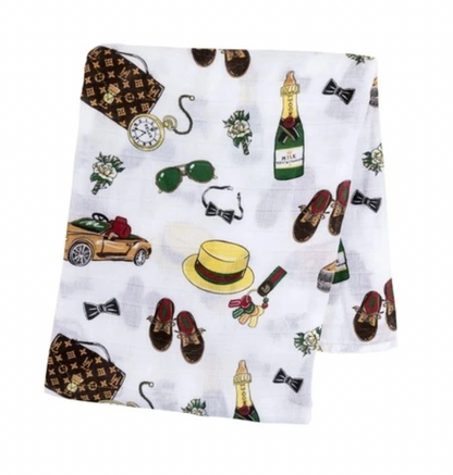 Baby swaddle blanket by Little Hometown, Dapper Napper design, soft fabric, wrapped around a sleeping infant.