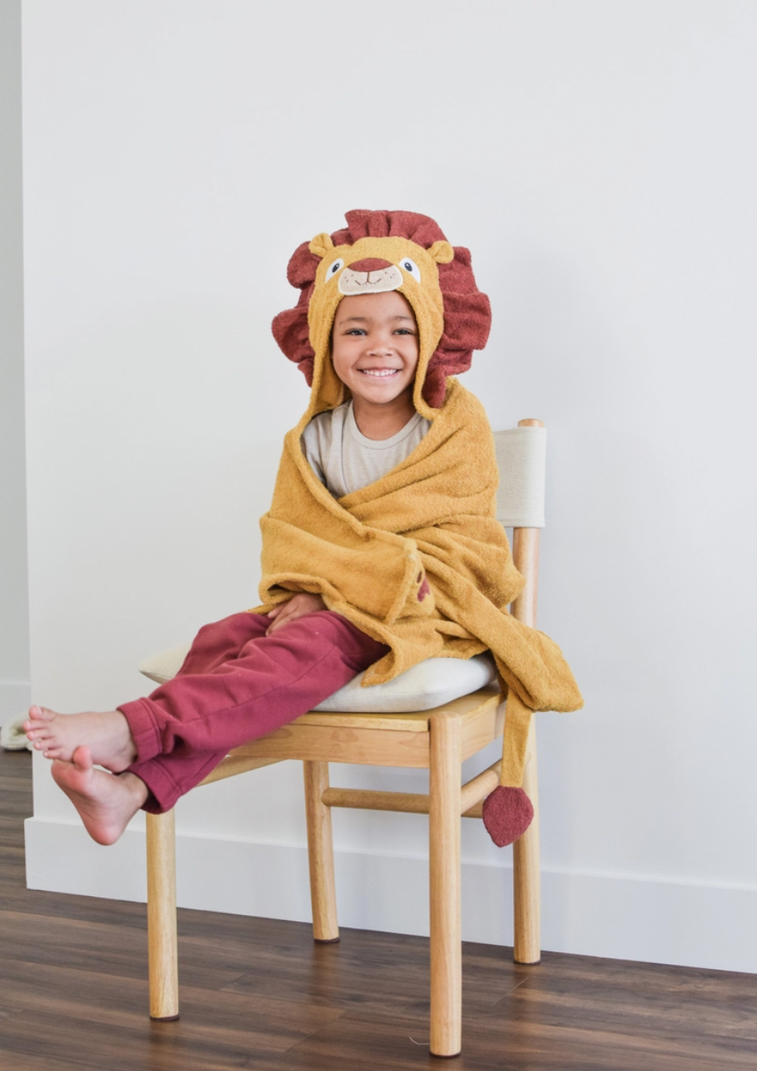 Kids lion hooded towel by Yikes Twins featuring a soft, plush hood with lion face design for children.